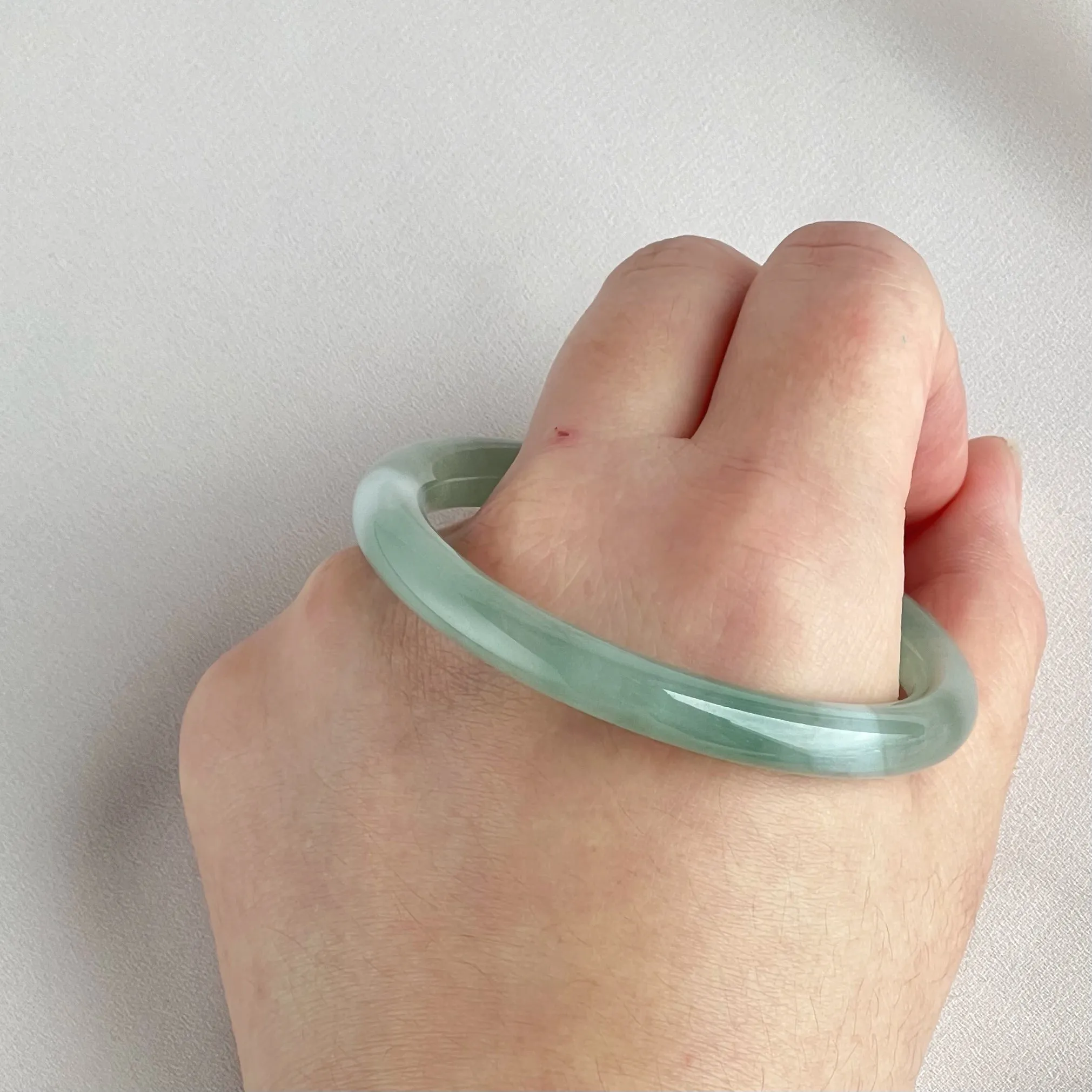 42055 55.5mm Highly Translucent Light Grape Green Jadeite Bangle