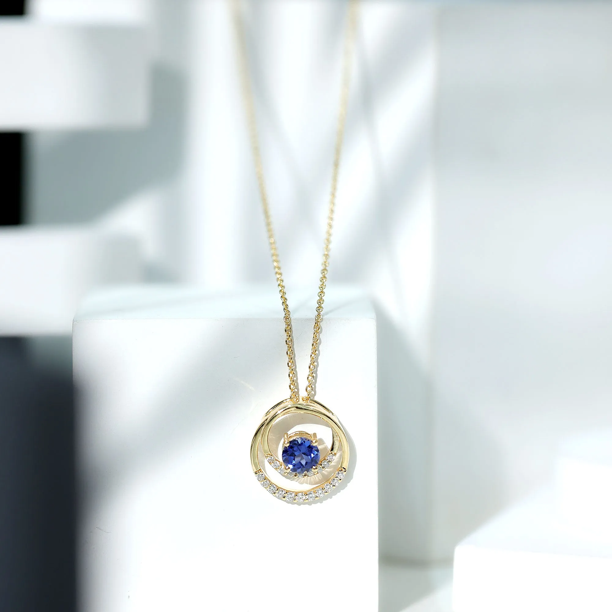 Certified Created Blue Sapphire and Moissanite Open Circle Pendant in Gold